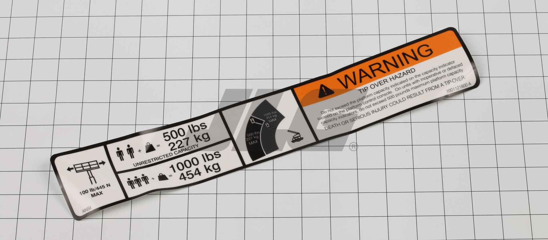 1001121800 Warning Dual Cap. Dom. Decal | JLG
